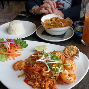 Pad Thai with Shrimp in foreground; Panang Curry with Chicken (and rice) in background