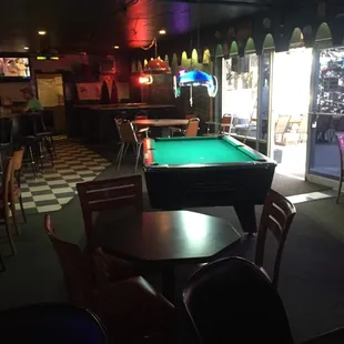 a pool table and chairs