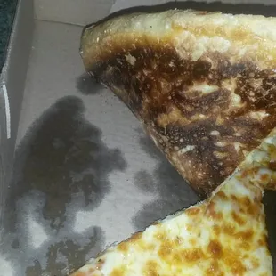 a half eaten pizza in a box