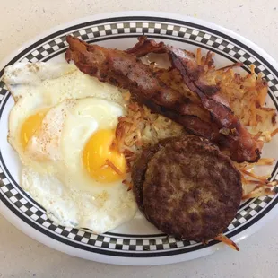 Eggs, bacon, sausage patties, and hash browns