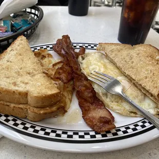 Classic breakfast with 3 large crips bacon, two eggs, hash brown, and wheat toast. Delicious &amp; compliments to chef and sweet staff.