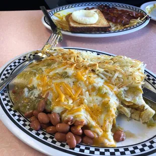 Breakfast burrito smothered with green chile.