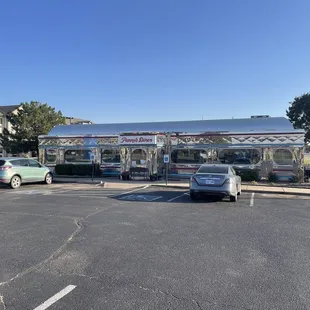 a diner and cars in a parking lot