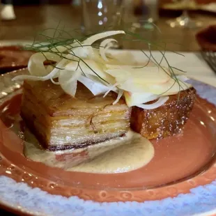 Potato dauphinois with fennel and pork belly