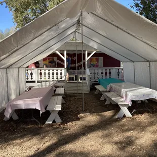 Main event dining space. Additional seating to the left and play area to the right.