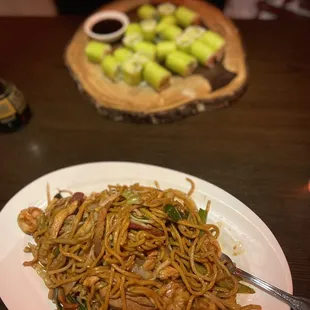 House lo mein and avocado rolls with soy paper and no sesame seeds.