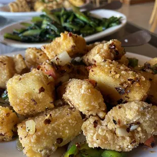 Spicy salt and pepper fish and tofu, spicy Chinese broccoli, black pepper chicken and jalapeños, our spicy sauce