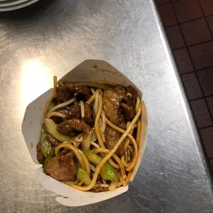 a bowl of noodles and meat
