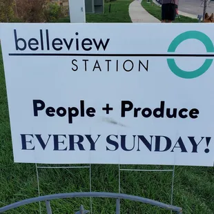 a sign in front of a building