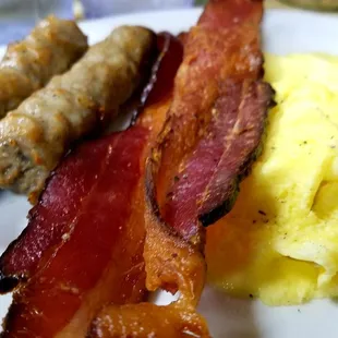 Sausage, bacon and scrambled eggs with my pancakes on a separate plate