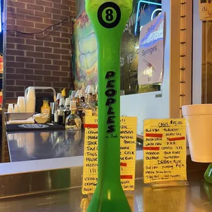 a neon green beer dispenser