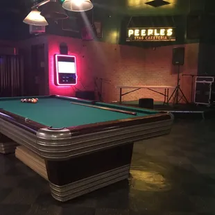 a pool table and neon lights