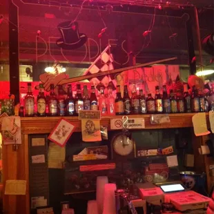 a bar filled with bottles of alcohol