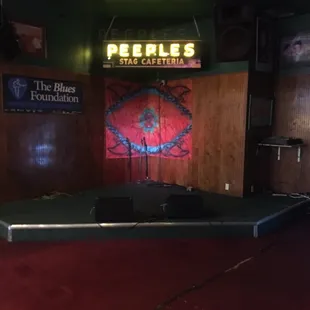 a stage with speakers and a projector