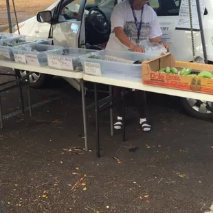 a woman selling produce