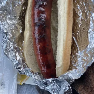 a hot dog wrapped in foil