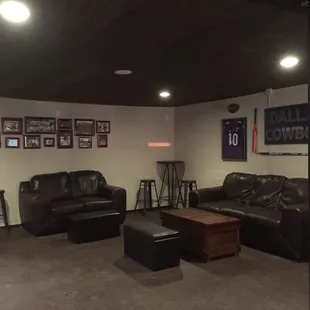 a living room with leather furniture