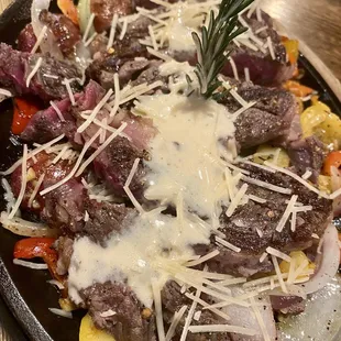 Ribeye on a skillet w/garlic butter