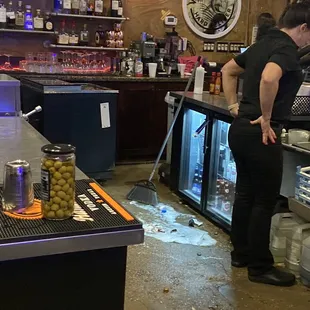  a man standing at the bar