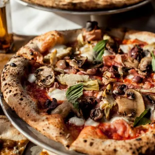 a pizza and a glass of wine