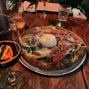 a pizza with an egg on top