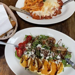 Orange, Goat Cheese and Tomato Salad Over Organic Greens