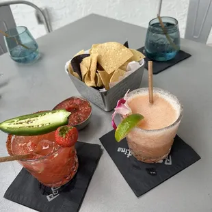 Chips and salsa, Strawberry jalapeño Margarita and a frozen guava margarita