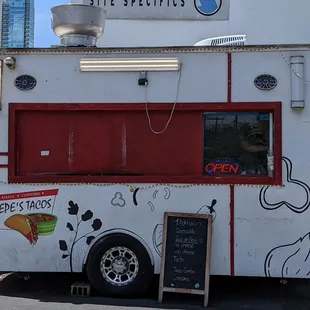 a food truck parked in front of a building