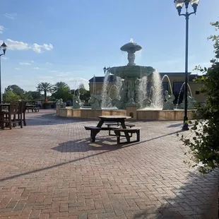 Outside seating with a view of the courtyard fountain.