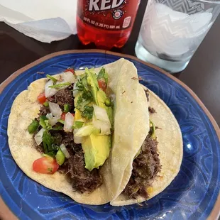 Barbacoa tacos with avocado and pico de gallo and of course Big Red