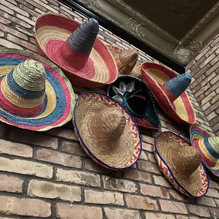 Nice wall decor accent with sombreros over brick!