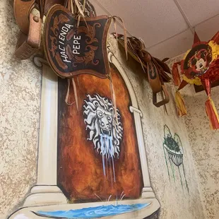 a mural of a lion's head