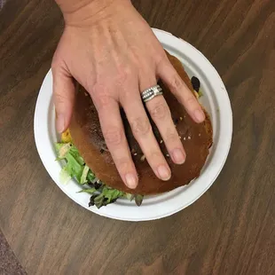 a person holding a plate of food