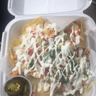 nachos in a styrofoam container