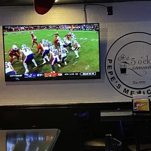 a christmas tree in front of a television