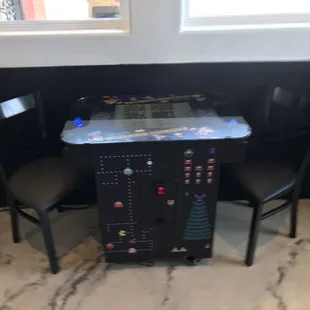 Pac man! In the same room w the pool tables.