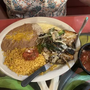 Chicken covered with poblano pepper and onions