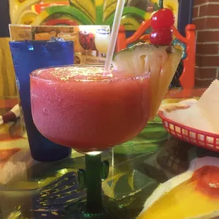 a drink with a pineapple garnish