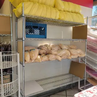 These racks are always full of  large bags of corn husks over the holidays!