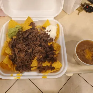 So called &quot;Super&quot; nachos w/ side of beans.