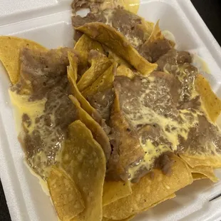 Soggy nachos with liquid cheese