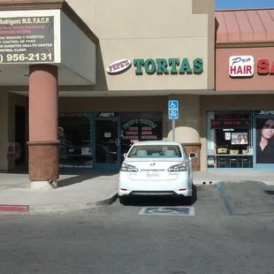 a car parked in front of a store