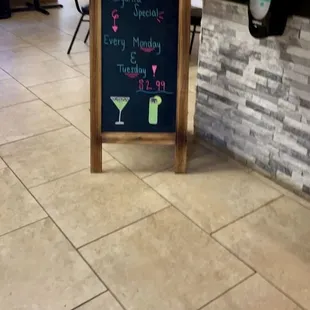 a chalkboard sign in a restaurant