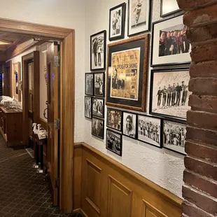 a brick wall with pictures on it