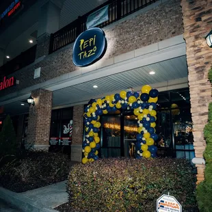 the entrance to a restaurant at night