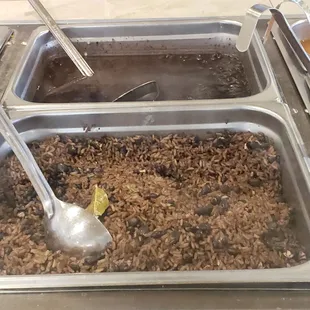 a close up of a serving dish of rice and beans