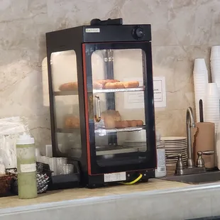 a display case with donuts in it