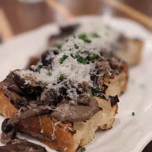 a mushroom toast with parmesan cheese