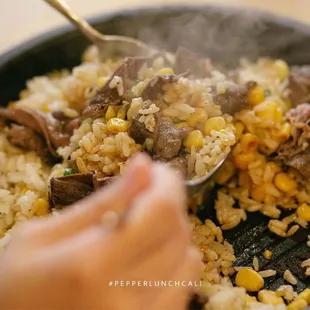 All Pepper Rice plates come with rice on the hot skillet for mixing.