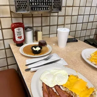 2 Eggs, Hashbrowns, delicious bacon and a pancake on the side